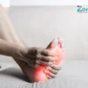 A person holding the bottom of their foot with visible pain highlighted, showing how to relieve pain on bottom of foot naturally.